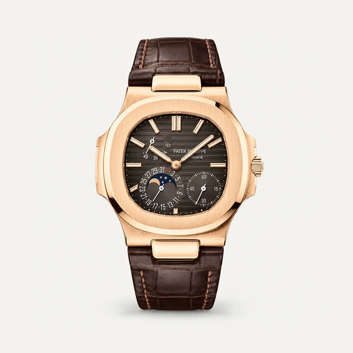 Patek Philippe Nautilus Moon Phase 5712R، ميناء بني · لون الذهب الوردي · حزام جلدي — صورة توضيحية وليست صورة للقطعة