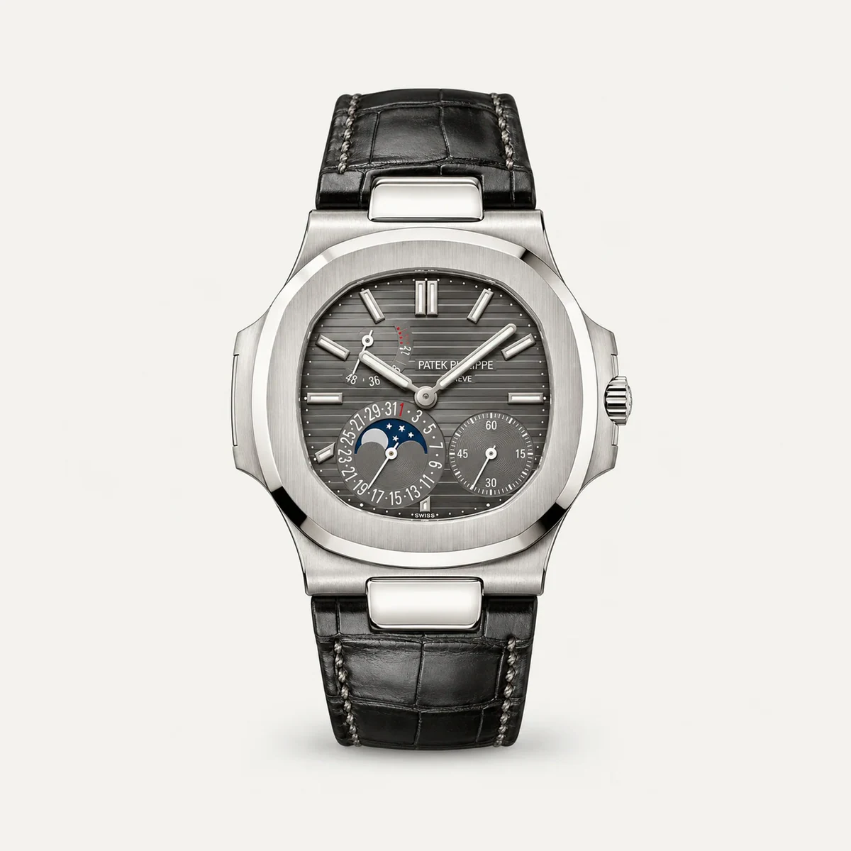 Patek Philippe Nautilus Moon Phase 5712G، ميناء رمادي أردوازي · لون الذهب الأبيض · حزام جلدي — صورة توضيحية وليست صورة للقطعة